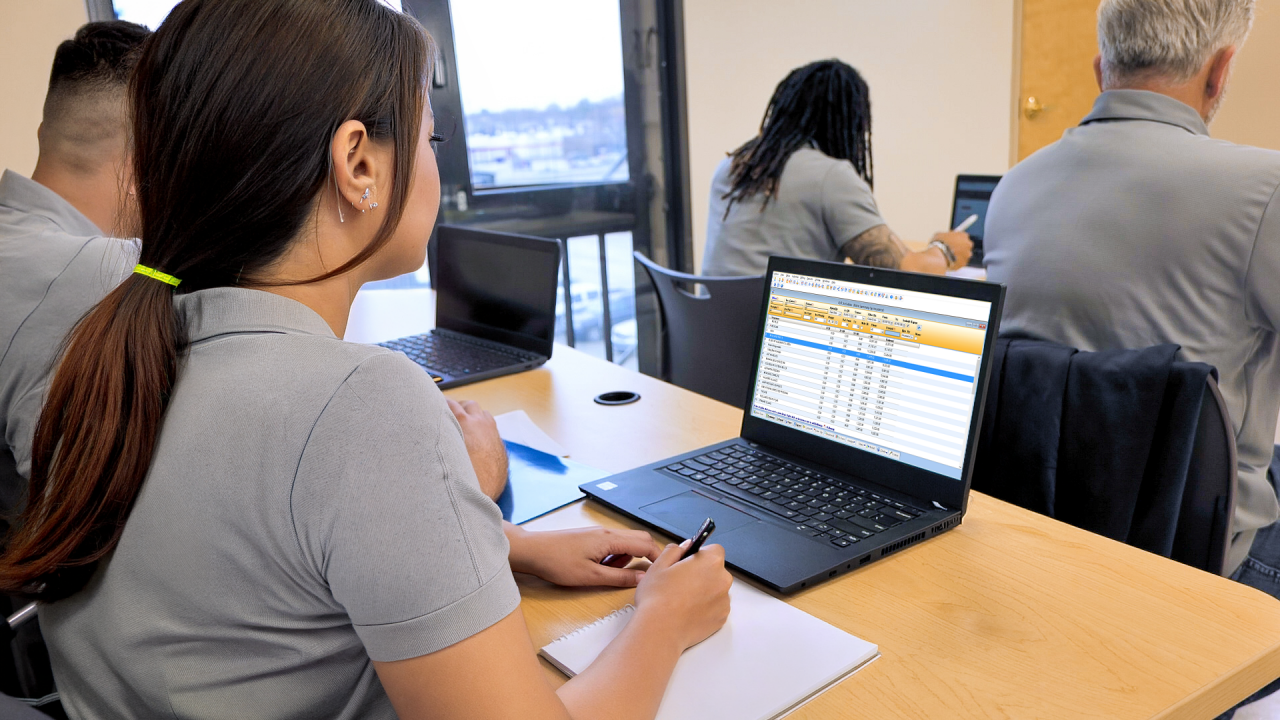people on computers in classroom
